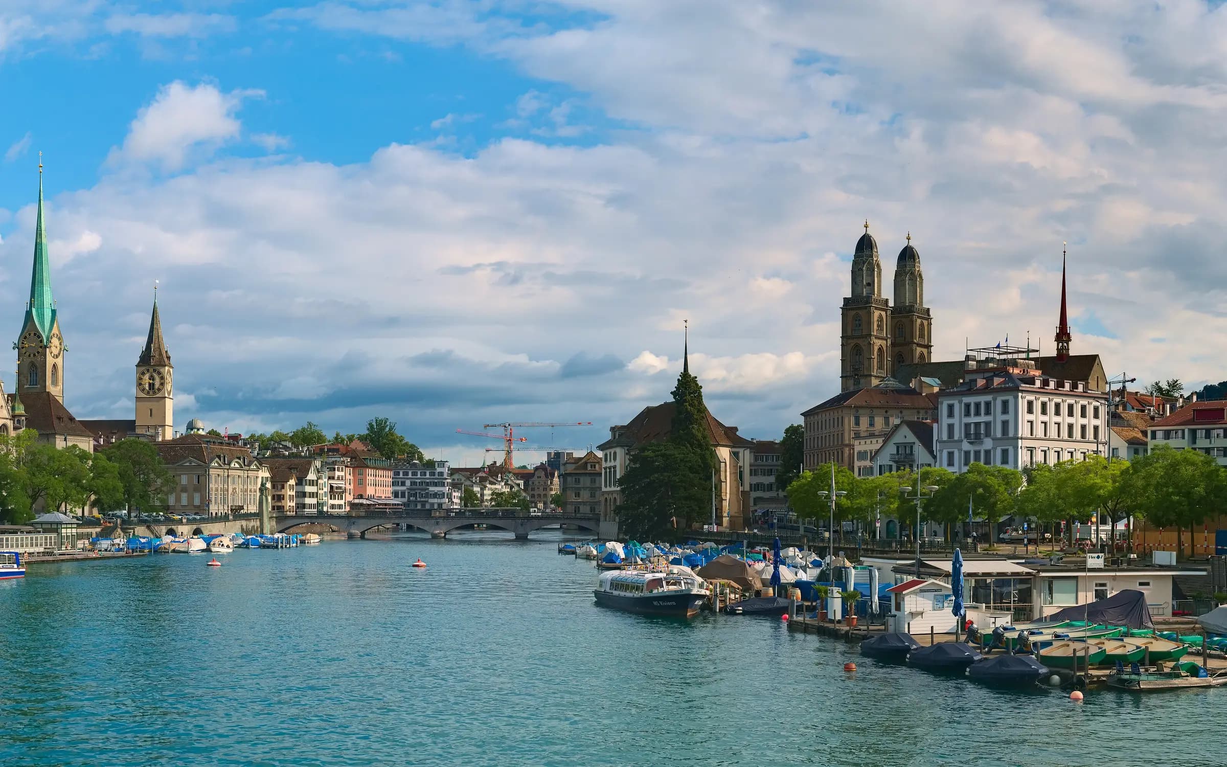 View over Zurich with the Limmat river, Fraumünster, and the lake